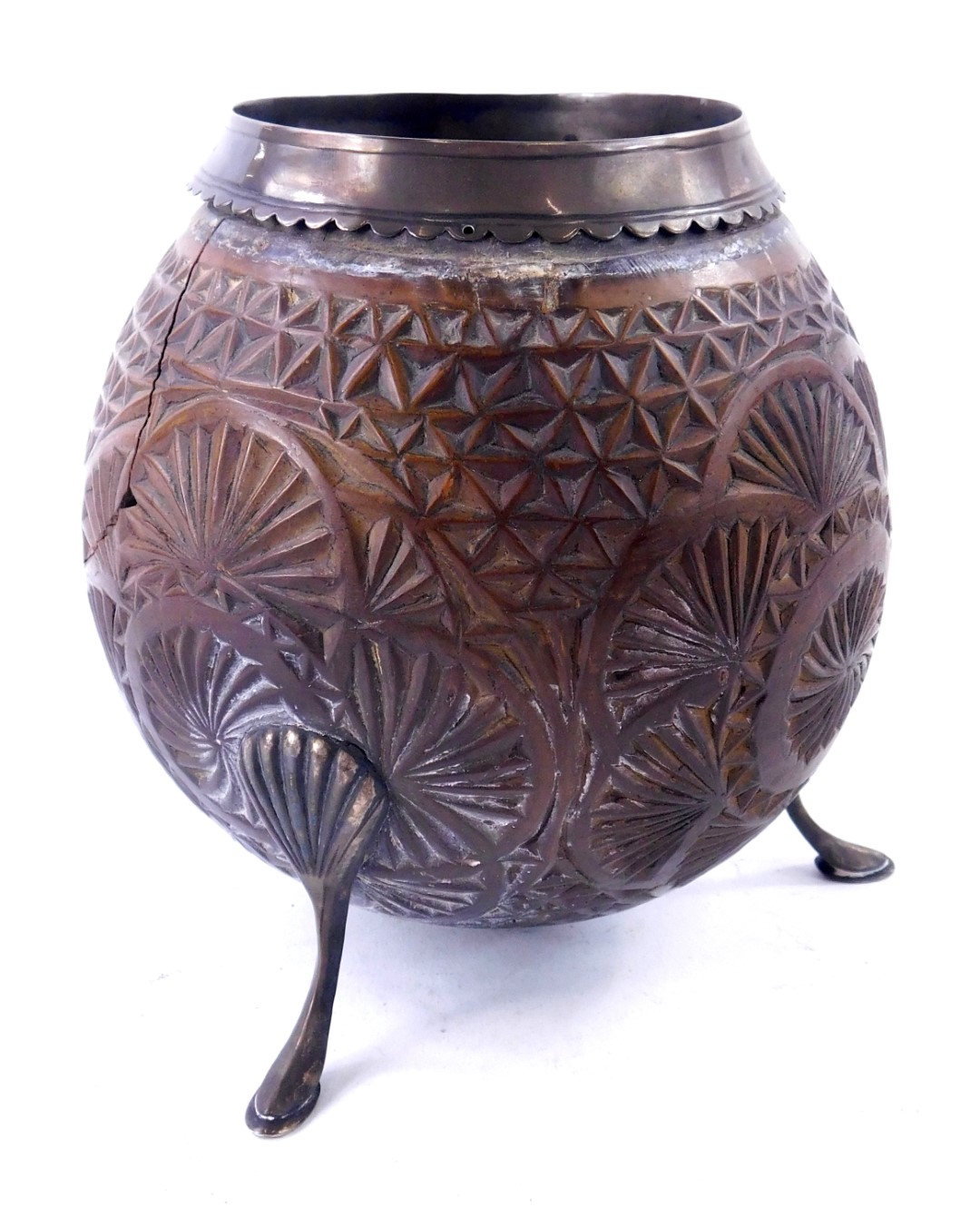 An early 19thC carved coconut, decorated overall with roundel's etc., with silver mounts, marks