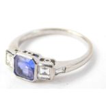 A diamond and tanzanite dress ring, set in 9ct white gold, the central tanzanite approx 1.21cts,