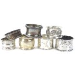 A collection of silver napkin rings, various designs, dates, etc., 3½oz overall.