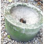 A circular stone hewn trough or sink, 39cm diameter.