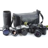 A quantity of camera equipment, to include a Nikon, various lens, etc.