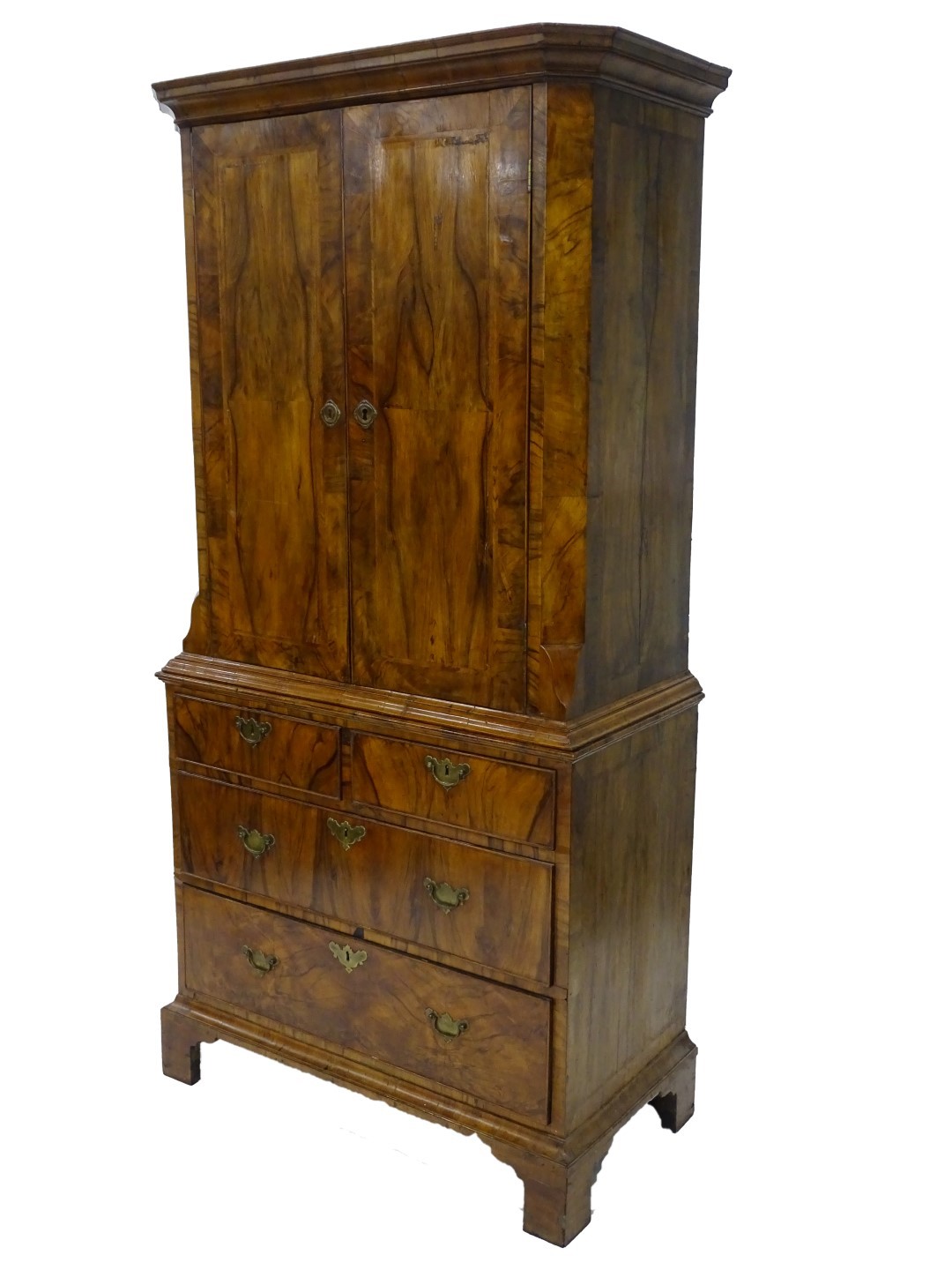 A late 19thC/early 20thC Dutch walnut and feather banded cabinet, the top with a moulded cornice