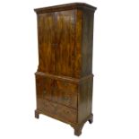 A late 19thC/early 20thC Dutch walnut and feather banded cabinet, the top with a moulded cornice