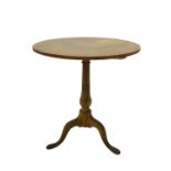 A 19thC oak and pine occasional table, with circular top on a turned column and tripod base, top and