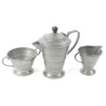 An H & H Warstone pewter three piece service, comprising of a coffee pot, 22cm H, milk jug and two