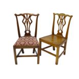 A near pair of George III oak side chairs, each with a pierced splat on plain legs, one with solid