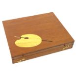 A mahogany and marquetry artist box, the lid inlaid with a palate and brush enclosing various