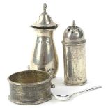 A collection of small silver, to include two pepper pots, enamel napkin ring, and a mustard spoon.