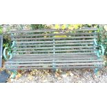 A slatted garden bench, with wrought iron supports, 179cm W.