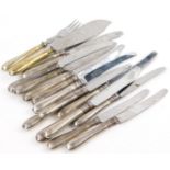 A quantity of table knives, fish servers etc., each with stainless steel blades, the handles stamped