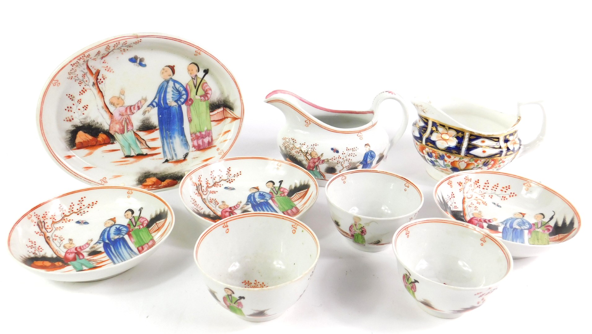 A Newhall porcelain late 18thC part tea service, decorated with chinoiserie figures in a garden,