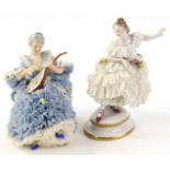 Two Dresden crinoline ladies, one playing a mandolin with a blue dress, 13cm H, and a young