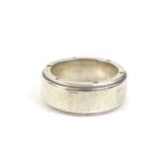 A Tiffany and Co silver wedding band, marked to interior C Tiffany and Co.925, with a makers stamp T