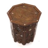 A Middle Eastern hardwood and mother of pearl inlaid occasional table, the octagonal top decorated