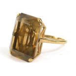 A 9ct gold rectangular cut smokey quartz dress ring, stone size 20mm x 15mm, 7.4g.