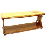 A Victorian figured mahogany two tier dumb waiter or buffet, the rectangular top with a moulded edge