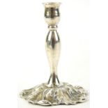 A Victorian miniature silver candlestick with leaf cast base, London 1885, 4cm H.