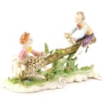 A Capodimonte style porcelain crinoline group, depicting two people on a seesaw, 29cm W.