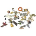 Various costume jewellery brooches, to include a silver filigree floral brooch, animal brooches,
