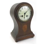 An Edwardian mahogany and simulated marquetry balloon shaped mantel clock, with French movement