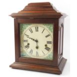 A German mantel clock, the printed dial with Roman numerals, in a mahogany case, 38cm H.