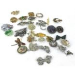 Various costume jewellery brooches, to include a Bakelite brooch, opal effect stone set sword