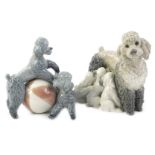 A pair of Lladro porcelain poodle groups, one with puppies, the other playing with a ball