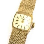 A 9ct gold Tissot ladies wristwatch, with square dial and applied stick markers, signed beneath