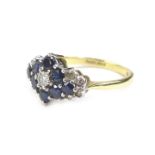 An 18ct gold cluster ring, set in floral design with sapphire and diamonds, each round brilliant