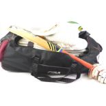 A collection of cricket equipment, to include an Adidas Pellara bat.