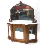 A Victorian walnut and marquetry side cabinet, the mirrored back decorated with leaves and scrolls