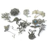 A quantity of costume jewellery brooches, to include silver and marcasite set sprays, silver