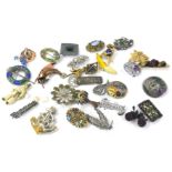 Costume jewellery brooches, to include 60s and 70s examples, silver plated musical brooch, apple