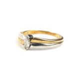 An 18ct gold diamond bi colour dress ring, the marquise shape diamond approx 0.2 carats, on bi