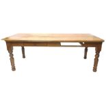 A large oak kitchen table, the rectangular top above two frieze drawers on turned legs, 99cm x