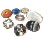 Various stone set brooches, to include a large agate set brooch in silver frame, and various other