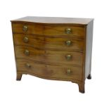 An early 19thC mahogany serpentine fronted chest of drawers, the top with a boxwood strung folder