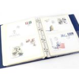 An album containing British coin covers, Royal commemorative first day covers etc.