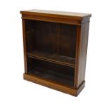 A late Victorian walnut open bookcase, with a reeded frieze and sides enclosing adjustable shelves