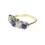 An 18ct gold sapphire and diamond dress ring, set with three round brilliant cut sapphires, and