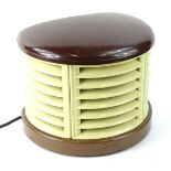 A mid 20thC Bakelite heater, of D end outline, with an open centre, 27cm H, 35cm W, 25cm D.