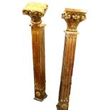 A pair of carved oak newel posts, each with a Corinthian and leaf carved capital etc.