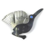 A silver bird brooch, with blackened silver body, raised blue enamel eye, makers stamp to rear,