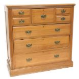 A Victorian pale walnut chest of drawers, the top with a moulded edge above an arrangement of two