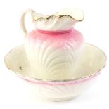 A shell moulded Victorian style wash jug and bowl, with pink and cream glaze