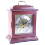 A German mahogany mantel clock, with a brass movement and Westminster chime, 30cm H