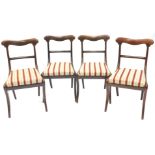 A set of four Regency mahogany dining chairs, each with a shaped bar back, a drop in seat, on