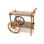 A continental hardwood and brass inlaid dinner wagon or trolley, with two glass and pierced