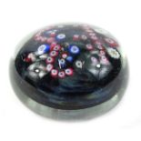 A Whitefriars paperweight, modelled in coloured canes with a crown etc., 8cm diameter.