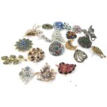 Various costume jewellery brooches, to include paste stone set floral spray brooches, of varying